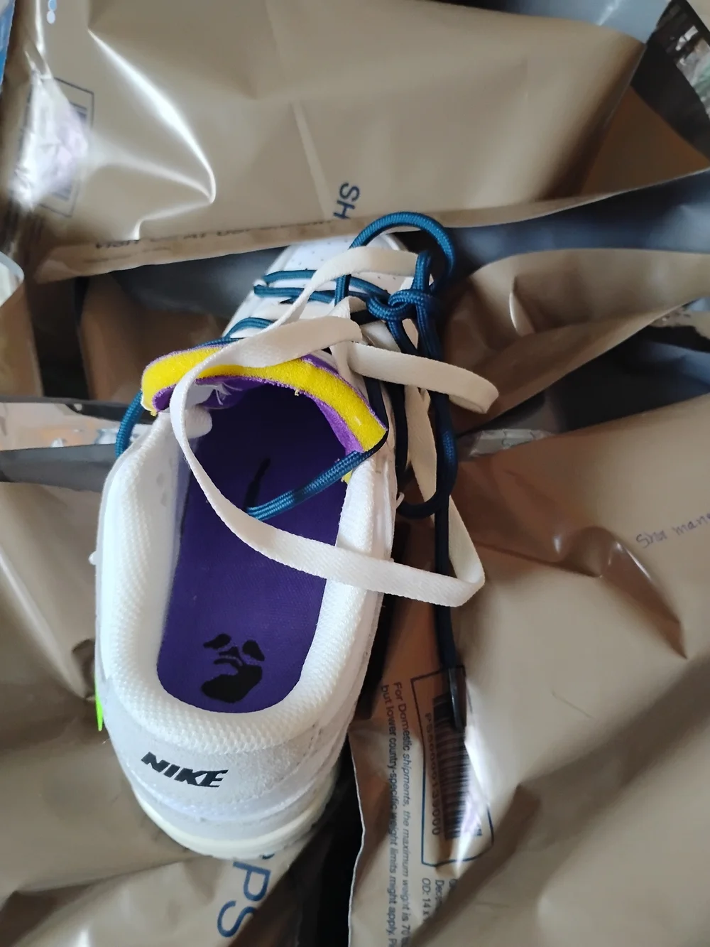 Nike Men’s White Sneakers with Purple and Yellow Accents